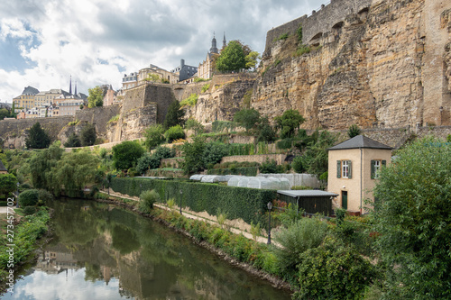 Alzette river Luxembourg city downtown Grund with fortifications and gardens