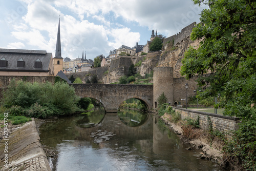 Alzette river Luxembourg city downtown Grund with fortifications and bridge