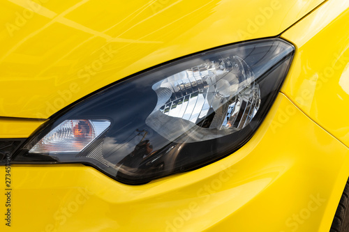 Yellow car headlights closeup photos