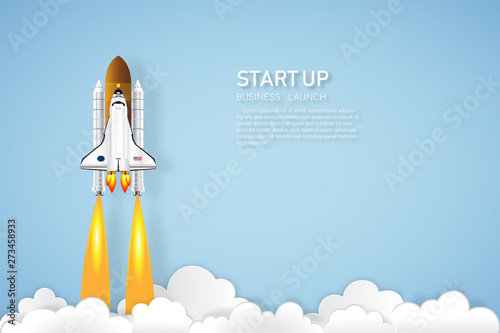Fototapeta Naklejka Na Ścianę i Meble -  Rocket launch on the clouds and blue sky as paper art, craft style and business Startup project concept. flat design vector illustration.