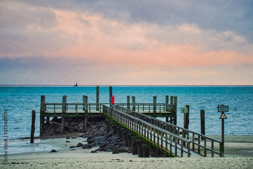 Pier at the beach of Wyk on the German Island of Foehr in cold November