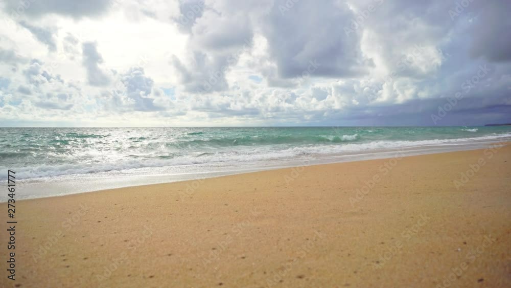 Tropical beach wave and sand and rocks with summer blue sky. Tropical beach wave and sand and rocks with summer blue sky.