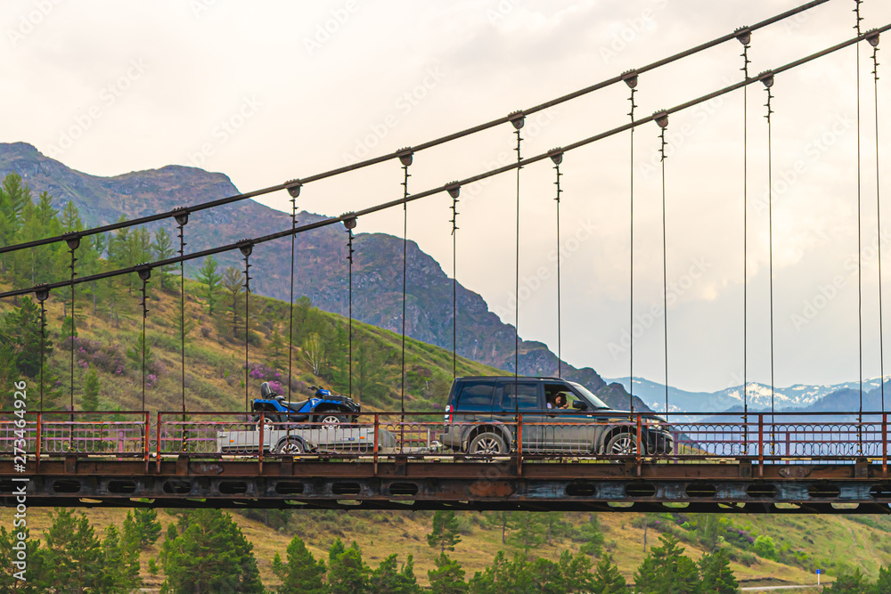 custom made wallpaper toronto digitalSUV passing over the bridge with a quad bike