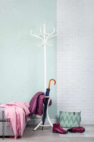 Stylish hallway interior with with clothes and shoes