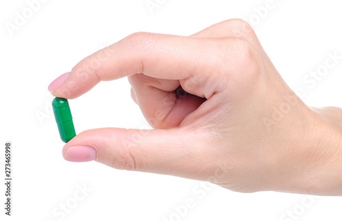 Green pills capcule medicine pharmasy in hand on white background isolation