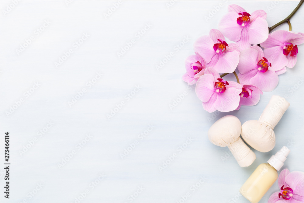 Sea salt, aromatherapy oil in bottles and orchid on vintage wooden background. Sea salt, aromatherapy oil in bottles and orchid on vintage wooden background.
