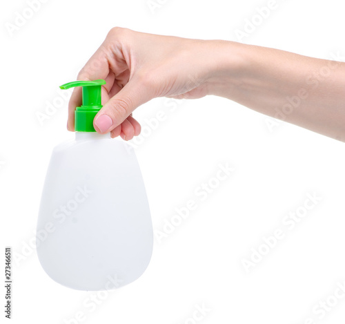 White bottle soap with dispenser in hand on white background isolation