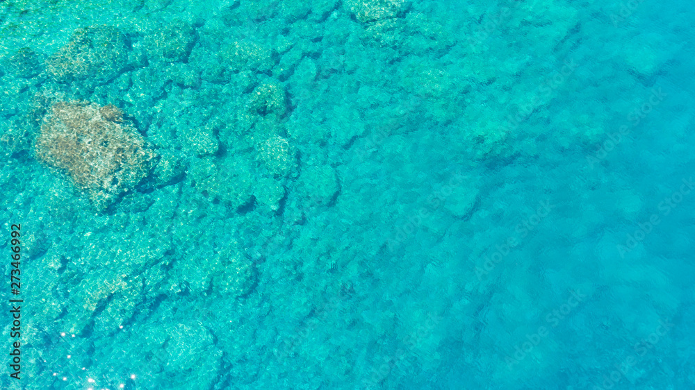 Background image of the turquoise sea. Deep sea and corals. Aerial drone shot of turquoise water. Background image of the turquoise sea. Deep sea and corals. Aerial drone shot of turquoise water.