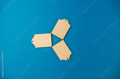 wooden tokens on a blue background. pattern. procurement photo