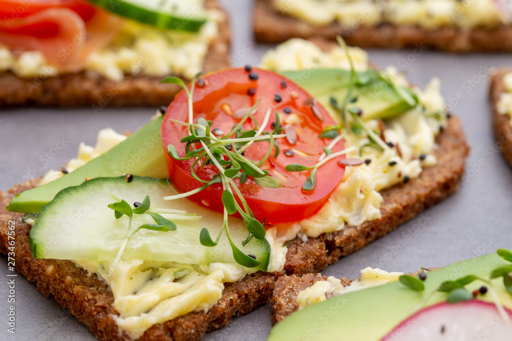 Sandwiches with cream cheese, vegetables and salami. Sandwiches with cream cheese, vegetables and salami.