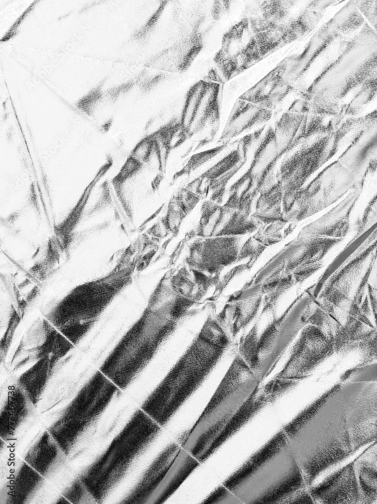 Fototapeta premium Crumpled silver material as abstract background