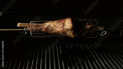 Grilled meat. Juicy meat on a grill skewer. Cooking meat on the grill. Tasty big hough is fried on a spit