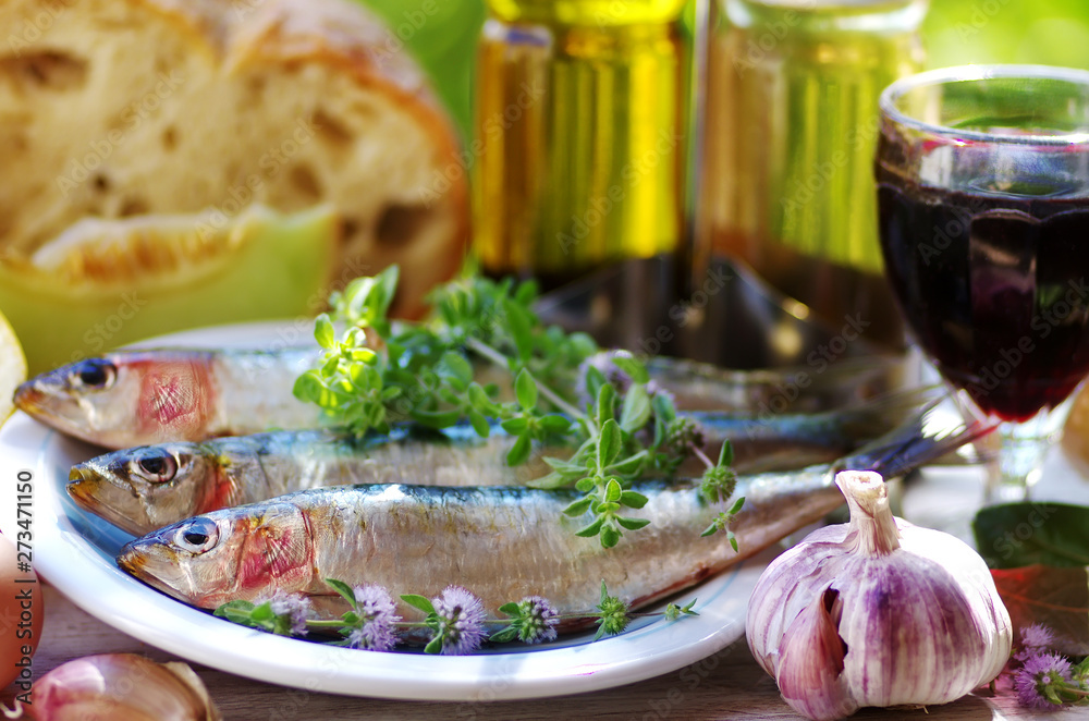sardines and food ingredients, spices on table sardines and food ingredients, spices on table