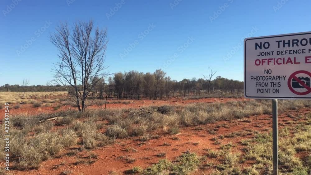 Vidéo Stock Warning sign on the road to Pine Gap.Pine Gap is a