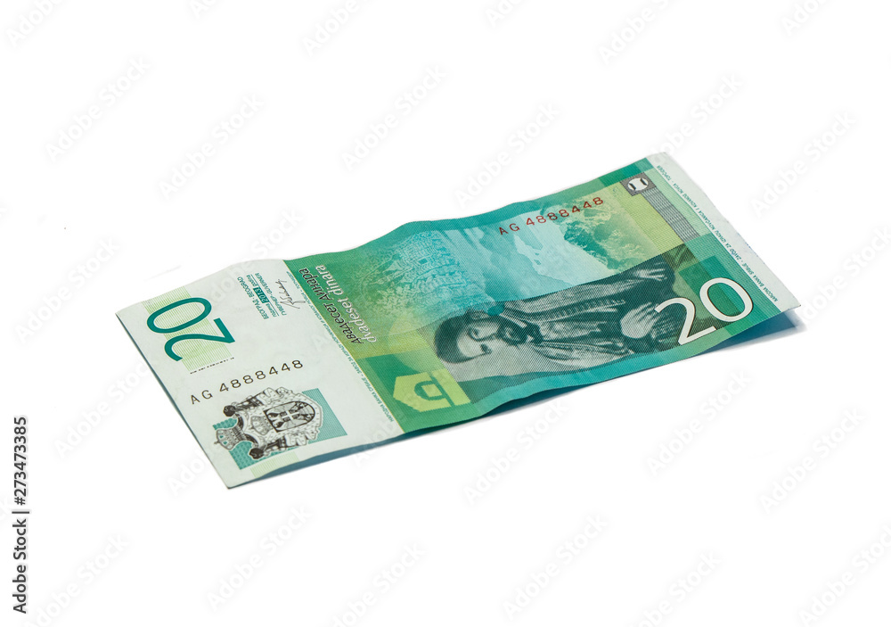 One banknote worth 20 Serbian Dinars with a portrait of the ruler of Montenegro Peter II Petrovich isolated on a white background One banknote worth 20 Serbian Dinars with a portrait of the ruler of Montenegro Peter II Petrovich isolated on a white background
