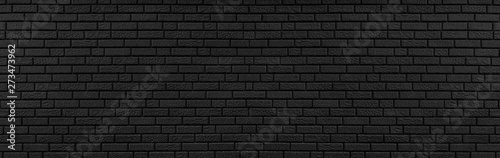 Panoramic texture of black brick wall, brickwork background for design or backdrop