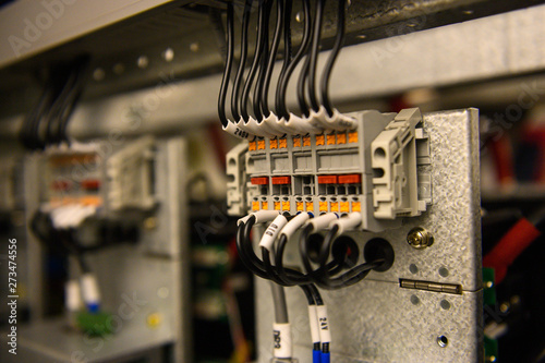 Wired electrical terminals and cutout on metal bar , wiring cable at terminal and junction box