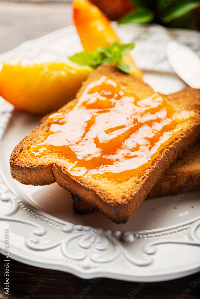 Healthy breakfast with toast and peach jam