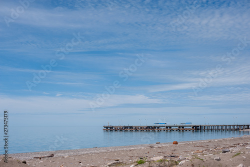 Sea pier  blue sky with light clouds