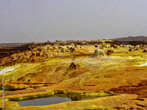 In the Danakilian depression of various fumaroles, steam emerges and water flows out. Ethiopia photo