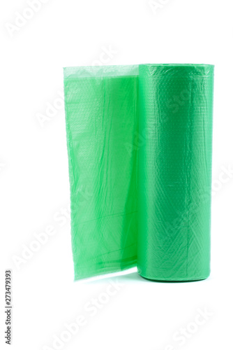 Roll green plastic garbage bagsRoll green plastic garbage bags isolated on the white background photo