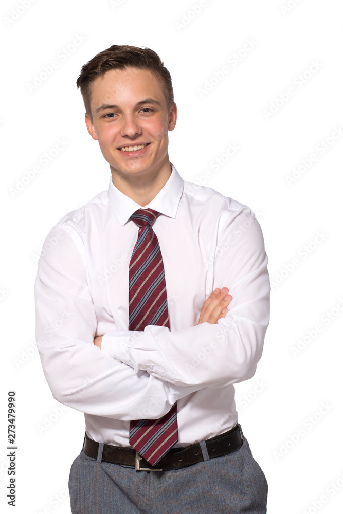 A handsome confident young man standing and smiling in a white shirt isolated on white. A handsome confident young man standing and smiling in a white shirt isolated on white.