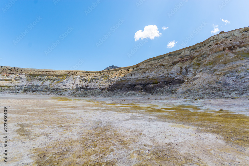 the hydrothermal crater of the sleeping Stefanos volcano is covered with white and yellow sulfur crystals on the island of Nisyros in Greece