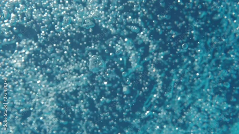 Bubbles rising to the surface. Slow motion. Air bubbles in clear blue water (underwater shot), good for backgrounds. Bubbles rising to the surface. Slow motion. Air bubbles in clear blue water (underwater shot), good for backgrounds.