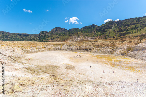 the panorama view at the hydrothermal crater of the sleeping Stefanos volcano is covered with white and yellow sulfur crystals on the island of Nisyros in Greece