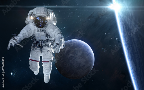 Fototapeta Naklejka Na Ścianę i Meble -  Star eclipse. Exoplanets and astronaut in deep space. Science fiction. Elements of this image furnished by NASA