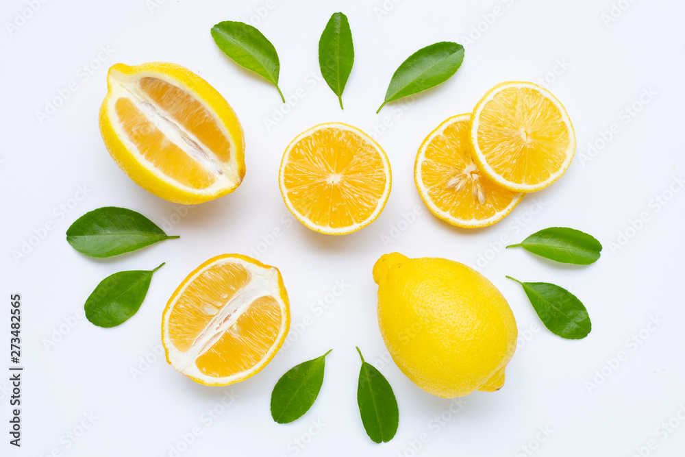 Naklejka lemon and slices with leaves isolated on white.