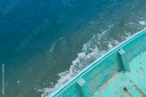 Top view of wooden boats that groove on the turquoise sea.