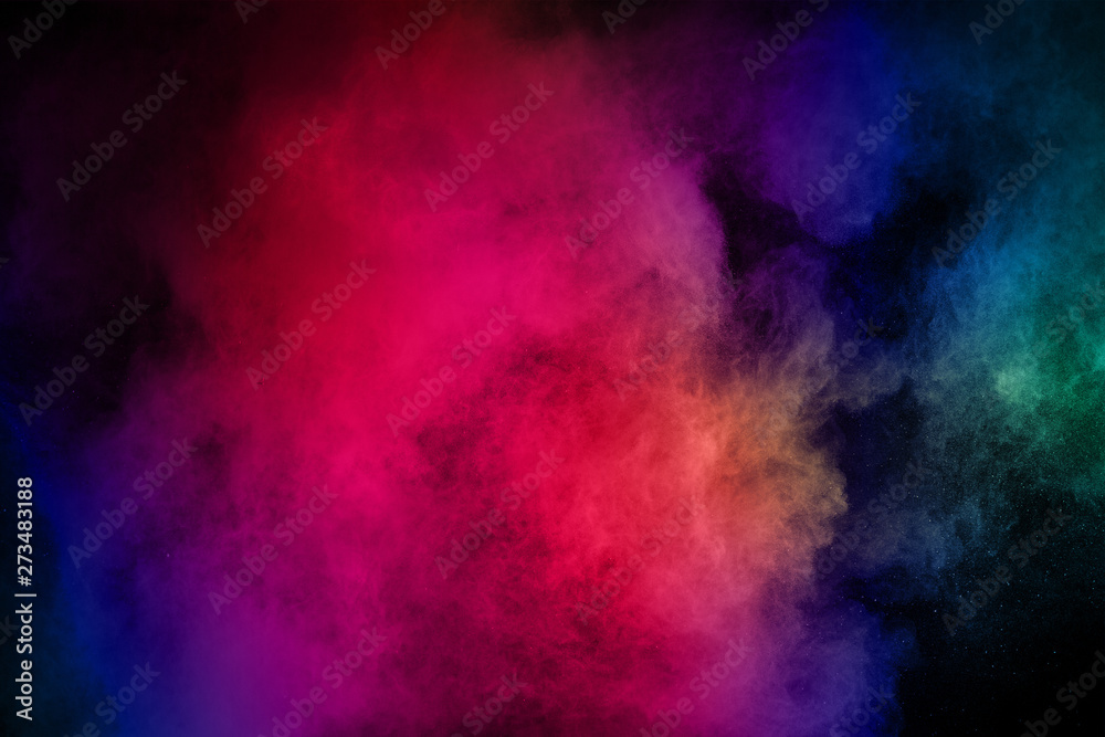 abstract colored dust explosion on a black background.abstract powder splatted background.