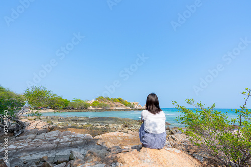 Young girl on Beautiful Tropical Beach PP Island, Krabi, Phuket, Thailand blue ocean background Woman items vacation accessories for holiday or long weekend a guide  choice idea for planning travel © Tony