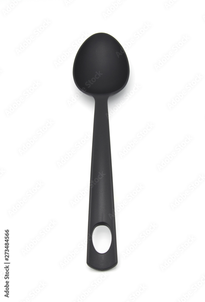 Black plastic kitchen utensil on a white background Black plastic kitchen utensil on a white background