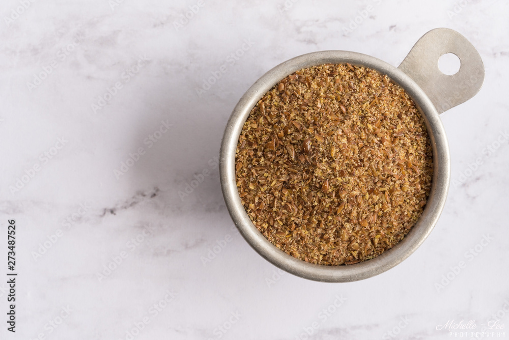 Flaxseed Meal in a Measuring Cup Flaxseed Meal in a Measuring Cup