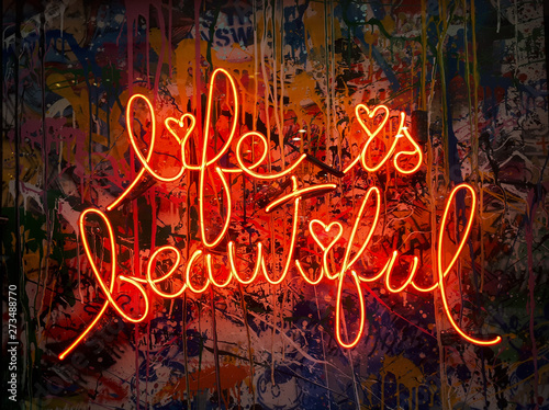 graffiti on the wall and neon text