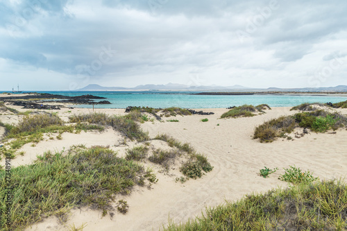 Views of Corralejo national park in Fuerteventura  from the beach of Isla de Lobos. Canary islandS   Spain. Volcanic seascape..