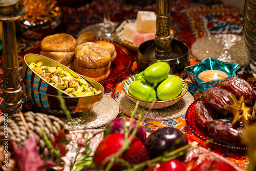 Close Up of Table decorated with Autumn and Winter Fruits and Edibles