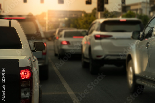 Luxury of cars stop on the asphalt junction by traffic light control in across. Traveling in the provinces during the bright period. Open light break in the city.