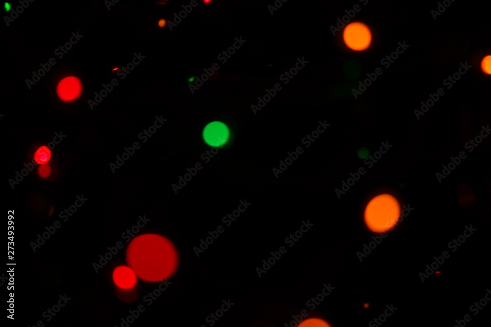 Photo of multicolored bokeh lights on black background. Photo of multicolored bokeh lights on black background.