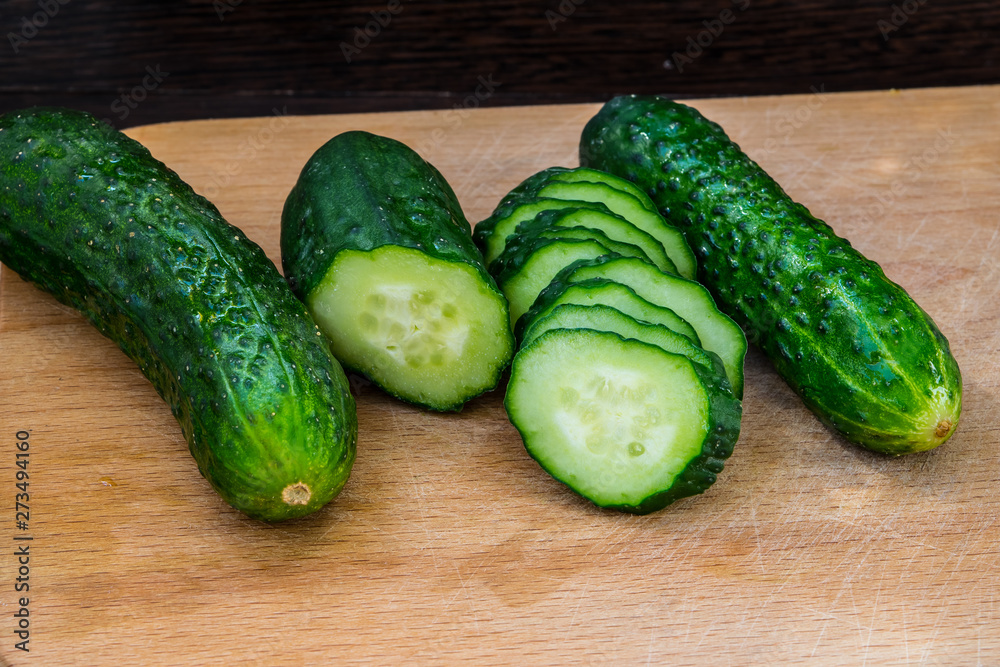 Cucumbers on a cutting board close up for healthy eating Cucumbers on a cutting board close up for healthy eating