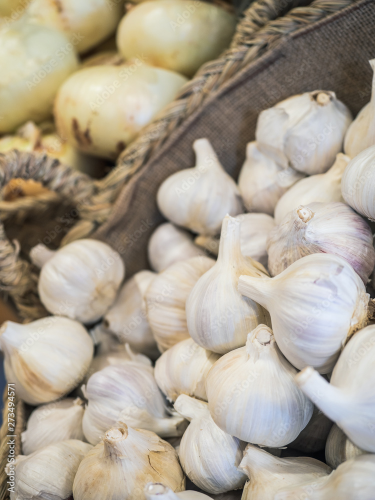 basket with garlic and onions organized in a fruit shop basket with garlic and onions organized in a fruit shop