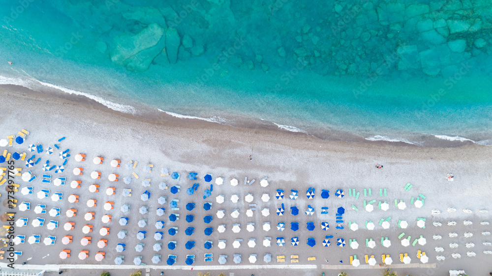 Beach and waves from top view. Aerial turquoise water background. Summer seascape from the air. Travel concept. 
