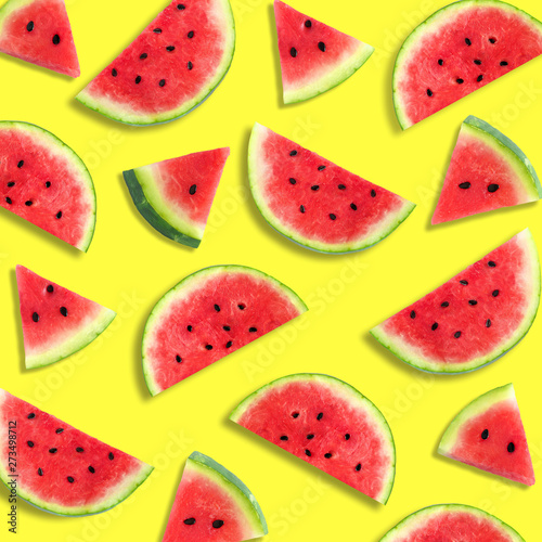 Fototapeta Naklejka Na Ścianę i Meble -  Colorful summer fruit pattern of watermelon slices on a vibrant yellow background