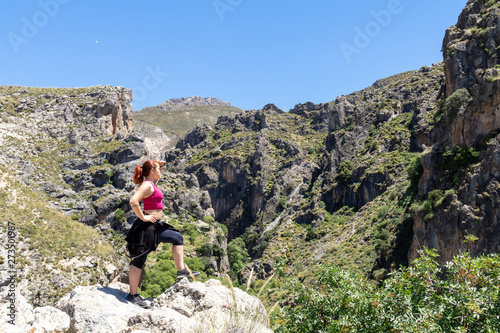 Strong girl at the mountain in Sierra Nevada