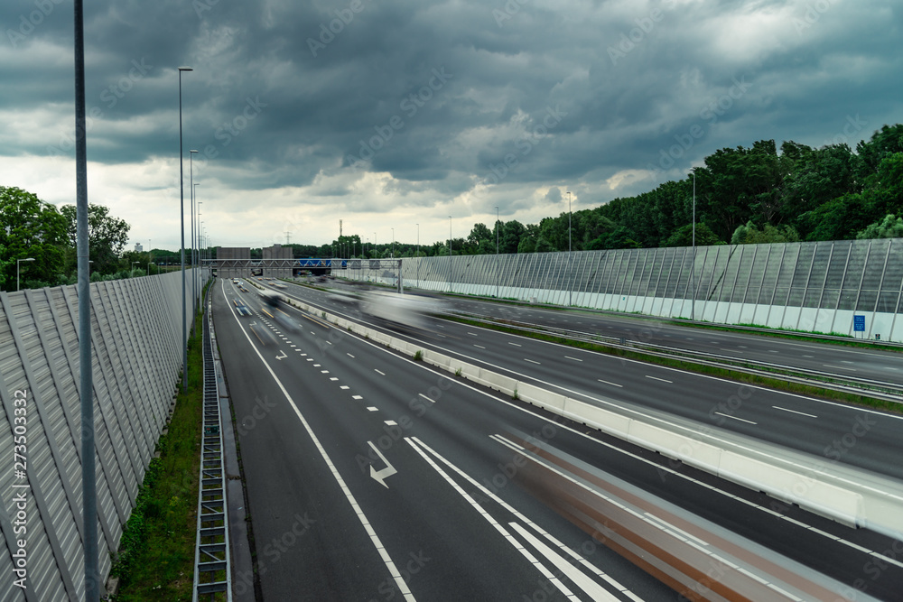 Traffic over the highway, motion blurred traffic, ring east A10, 06/14/2019 Amsterdam the Netherlands, speedway, freeway fast