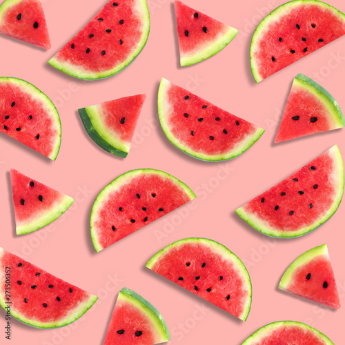 Fototapeta Naklejka Na Ścianę i Meble -  Colorful summer fruit pattern of watermelon slices on a pastel pink background