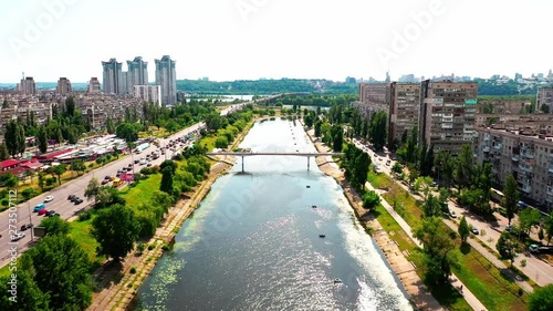 4K, Drone, Slow moving shot of the water canal and apartment buildings at Rusanovka Island, Ukraine. photo