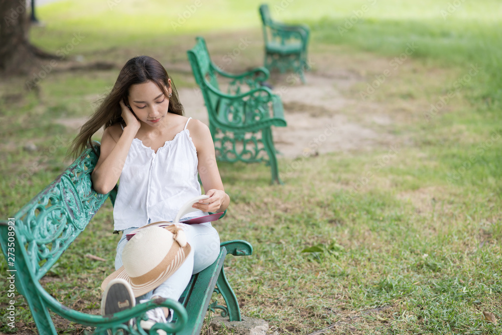 Relax woman read book in park Relax woman read book in park